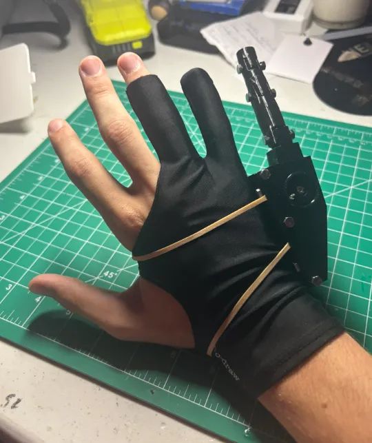 The 6th Finger prosthetic worn on a hand