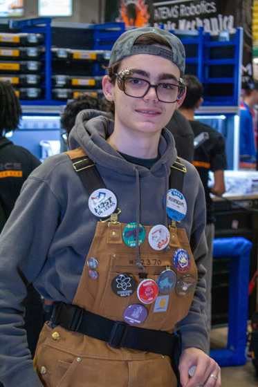 James Japhet at the 2025 Reefscape event wearing a FIRST in Texas button and a team 9444 drive team badge